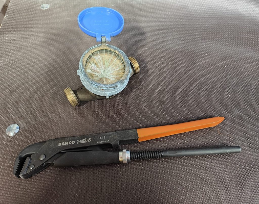 Water meter and a tool.